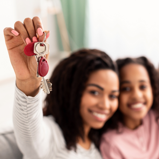 happy woman holding house keys