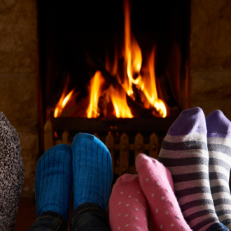 stocking feet in front of the fireplace 