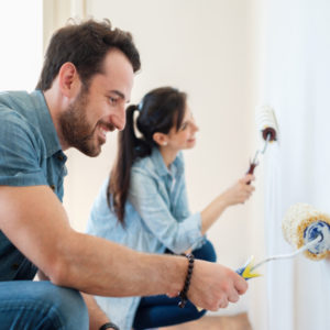 couple painting wall